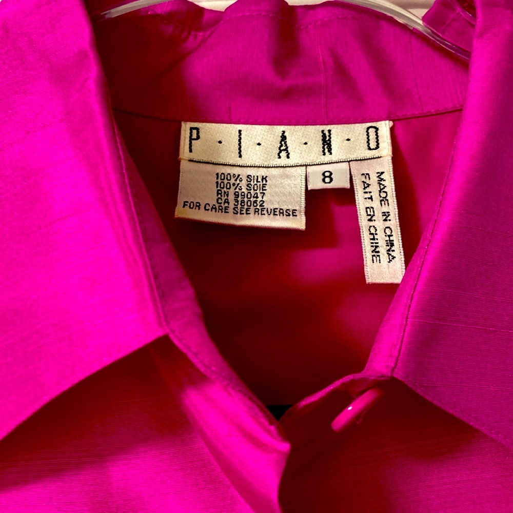 Like new, 100% silk pink top and pants with simple elegant leafy patterns.